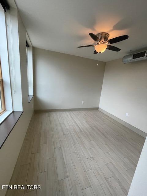 603 W Main St Unit 208, Knoxville, TN 37902 - empty room with ceiling fan and wood finished floors