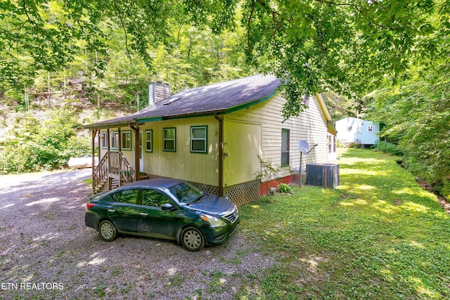 3255 Bear Mountain Ln, Sevierville, TN 37876 - view of side of property with a chimney and a central air condition unit