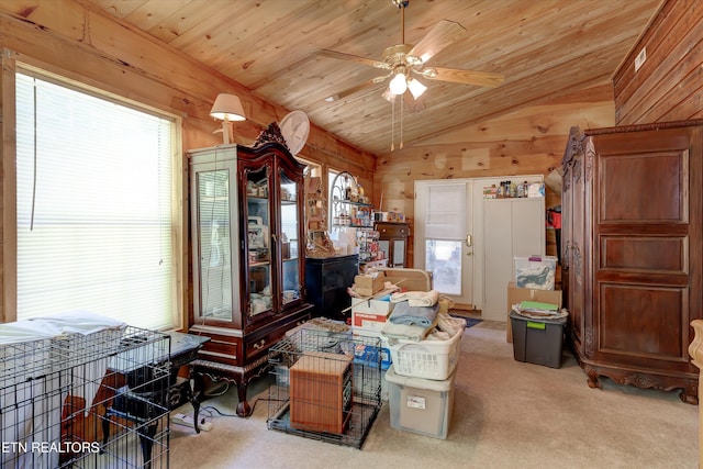 3255 Bear Mountain Ln, Sevierville, TN 37876 - sitting room featuring vaulted ceiling, a ceiling fan, wood walls, wood ceiling, and carpet