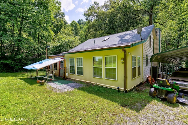 3255 Bear Mountain Ln, Sevierville, TN 37876 - rear view of property with a yard, a carport, and a forest view