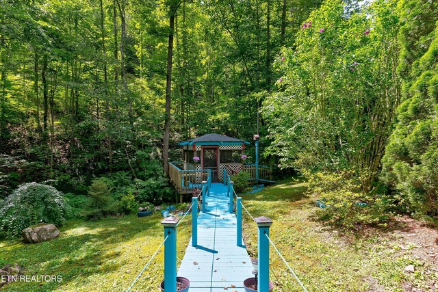 3255 Bear Mountain Ln, Sevierville, TN 37876 - dock area featuring a gazebo, a view of trees, and a wooden deck