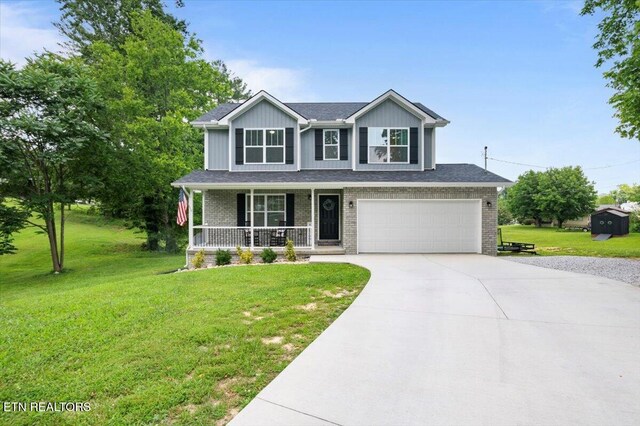 226 Hilldale Ln, Lafollette, TN 37766 - view of front facade featuring covered porch, driveway, an attached garage, a front lawn, and brick siding