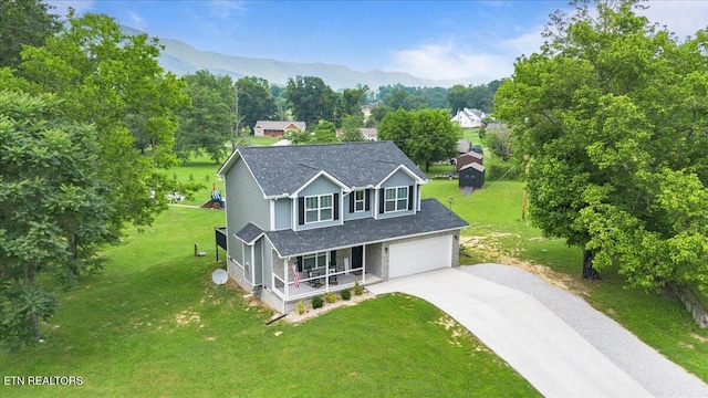 226 Hilldale Ln, Lafollette, TN 37766 - traditional home with a porch, driveway, a front yard, and a mountain view
