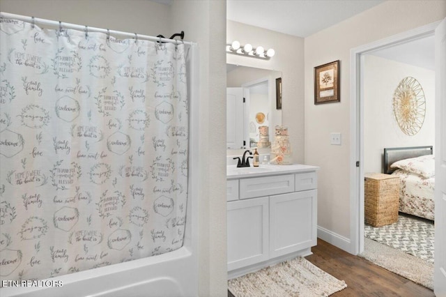 226 Hilldale Ln, Lafollette, TN 37766 - ensuite bathroom featuring vanity, wood finished floors, and shower / bathtub combination with curtain