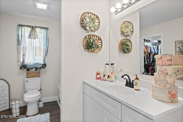 226 Hilldale Ln, Lafollette, TN 37766 - full bath with vanity, wood finished floors, and a walk in closet