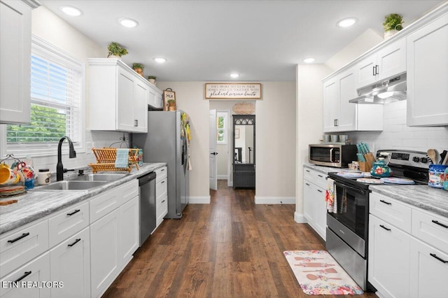 226 Hilldale Ln, Lafollette, TN 37766 - kitchen featuring stainless steel appliances, under cabinet range hood, white cabinets, light countertops, and decorative backsplash
