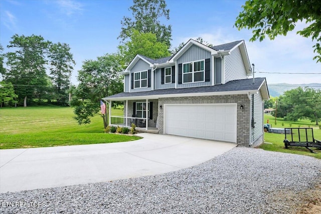226 Hilldale Ln, Lafollette, TN 37766 - view of front facade featuring driveway, covered porch, an attached garage, a front yard, and board and batten siding