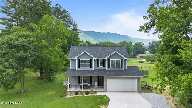 226 Hilldale Ln, Lafollette, TN 37766 - view of front of property with a porch, concrete driveway, a front lawn, and a mountain view