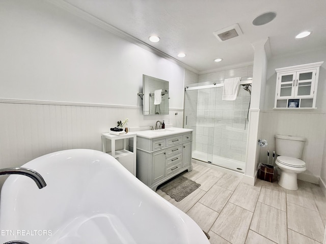 3402 Lillie Blvd, Sevierville, TN 37876 - full bathroom with ornamental molding, vanity, a freestanding bath, a shower stall, and recessed lighting