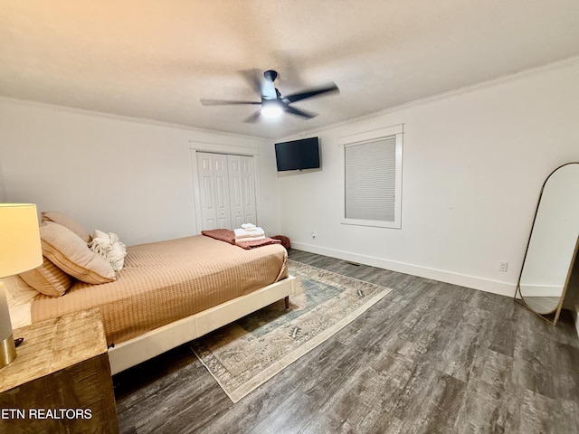 3402 Lillie Blvd, Sevierville, TN 37876 - bedroom featuring dark wood-type flooring, ornamental molding, a closet, and a ceiling fan