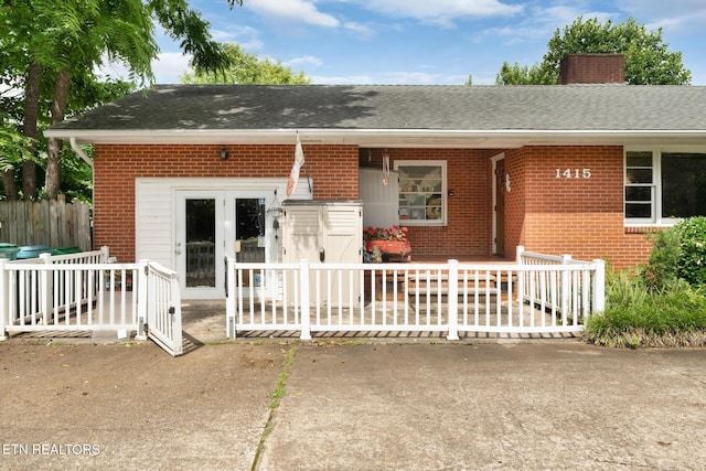 1415 Ebenezer Rd, Knoxville, TN 37922 - view of front of property featuring brick siding, a chimney, and roof with shingles