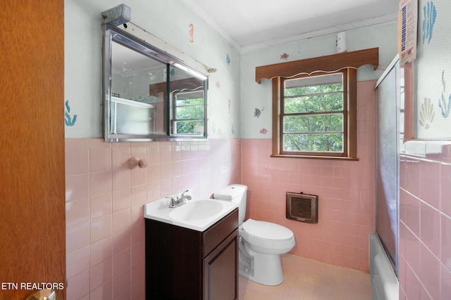 1415 Ebenezer Rd, Knoxville, TN 37922 - full bathroom featuring vanity, tile walls, ornamental molding, heating unit, and a wainscoted wall