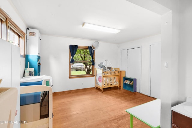 1415 Ebenezer Rd, Knoxville, TN 37922 - bedroom featuring light wood-style flooring and freestanding refrigerator