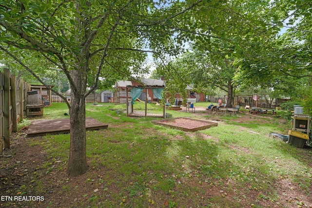 1415 Ebenezer Rd, Knoxville, TN 37922 - fenced backyard with a shed and a wooden deck