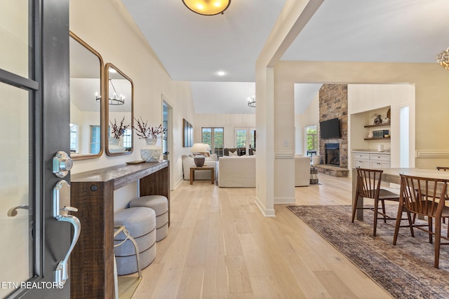 200 Stony Rock Ln, Jacksboro, TN 37757 - foyer with a fireplace, light wood-type flooring, a chandelier, and recessed lighting