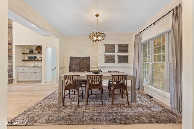 200 Stony Rock Ln, Jacksboro, TN 37757 - dining room featuring wood finished floors and a chandelier