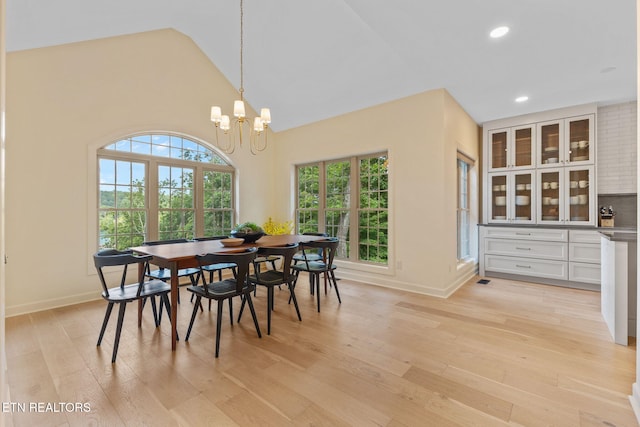 200 Stony Rock Ln, Jacksboro, TN 37757 - dining space with light wood-style flooring, recessed lighting, a chandelier, and high vaulted ceiling