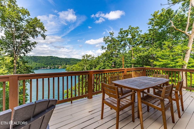 200 Stony Rock Ln, Jacksboro, TN 37757 - deck with a water view, outdoor dining area, and a wooded view