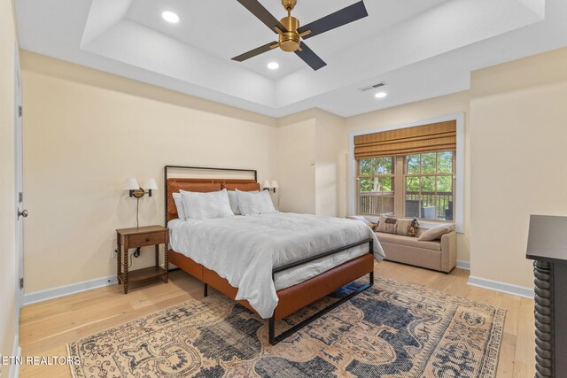 200 Stony Rock Ln, Jacksboro, TN 37757 - bedroom with a raised ceiling, light wood-type flooring, recessed lighting, and ceiling fan