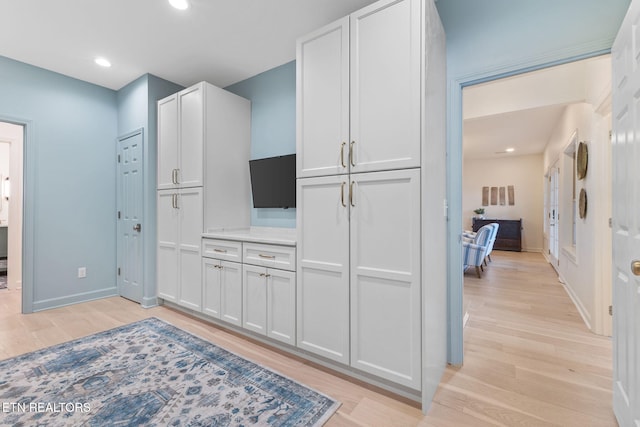 200 Stony Rock Ln, Jacksboro, TN 37757 - kitchen with light wood-type flooring, white cabinets, recessed lighting, and light countertops