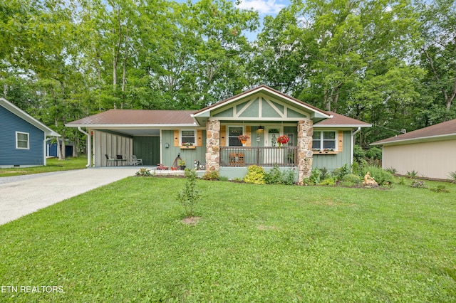 137 Jasper Dr, Crossville, TN 38558 - view of front of home featuring a porch, board and batten siding, a front yard, and driveway