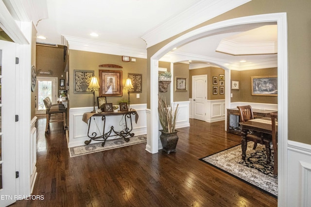 8507 Cloudbreak Ln Unit 4, Knoxville, TN 37938 - hallway featuring arched walkways, crown molding, a wainscoted wall, wood finished floors, and a decorative wall