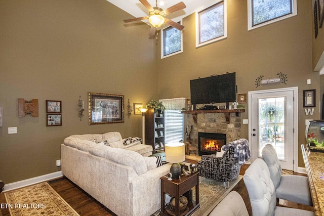 8507 Cloudbreak Ln Unit 4, Knoxville, TN 37938 - living room with a ceiling fan, a high ceiling, dark wood finished floors, and a fireplace