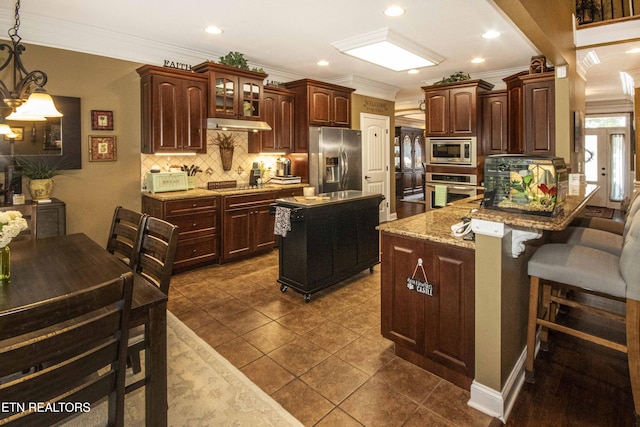 8507 Cloudbreak Ln Unit 4, Knoxville, TN 37938 - kitchen with appliances with stainless steel finishes, ornamental molding, tasteful backsplash, dark brown cabinetry, and glass insert cabinets