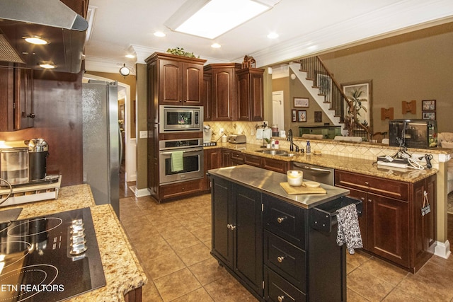 8507 Cloudbreak Ln Unit 4, Knoxville, TN 37938 - kitchen featuring appliances with stainless steel finishes, tasteful backsplash, crown molding, a peninsula, and extractor fan
