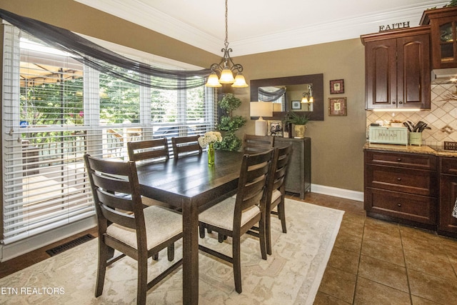 8507 Cloudbreak Ln Unit 4, Knoxville, TN 37938 - dining area with a chandelier, crown molding, and dark tile patterned floors