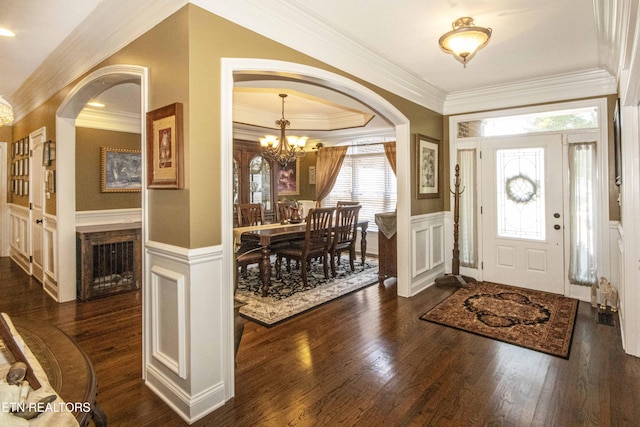 8507 Cloudbreak Ln Unit 4, Knoxville, TN 37938 - entrance foyer featuring a decorative wall, arched walkways, a chandelier, crown molding, and a wainscoted wall