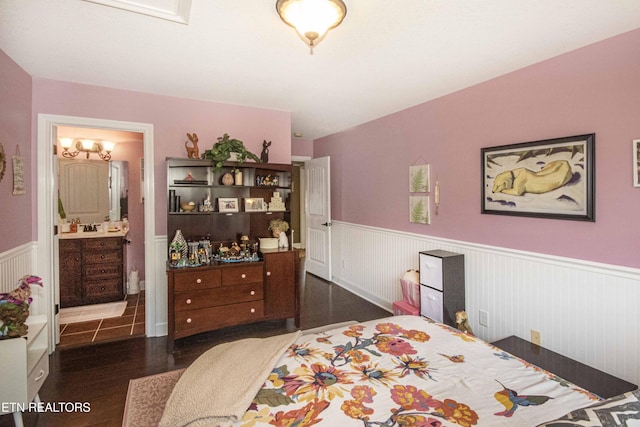 8507 Cloudbreak Ln Unit 4, Knoxville, TN 37938 - bedroom with wainscoting, wood finished floors, and ensuite bathroom