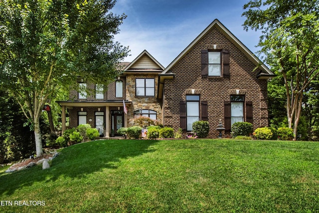 8507 Cloudbreak Ln Unit 4, Knoxville, TN 37938 - view of front of house featuring a front yard and brick siding