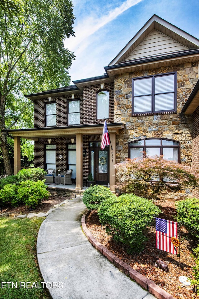 8507 Cloudbreak Ln Unit 4, Knoxville, TN 37938 - view of front of property featuring brick siding, a porch, and stone siding