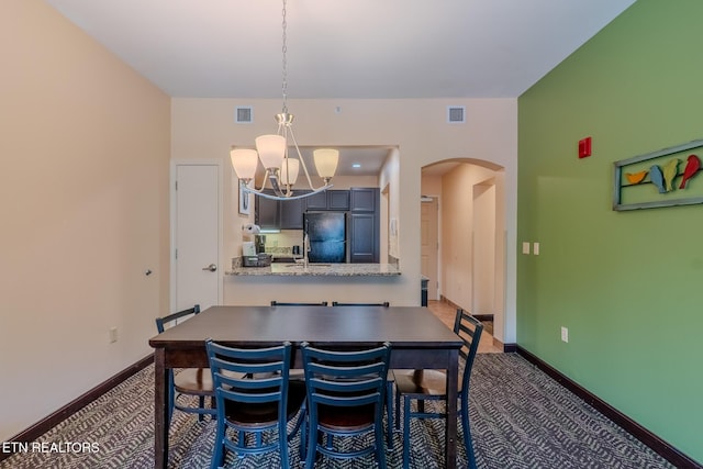 225 Collier Dr Unit 2212, Sevierville, TN 37862 - dining space with arched walkways, carpet floors, and a chandelier