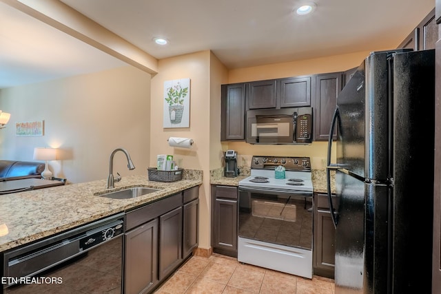 225 Collier Dr Unit 2212, Sevierville, TN 37862 - kitchen with black appliances, light stone countertops, light tile patterned floors, a peninsula, and recessed lighting
