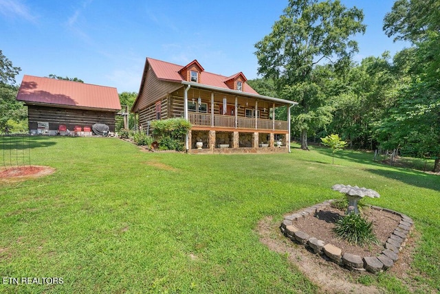 1821 S Nopone Valley Rd, Decatur, TN 37322 - rear view of house with a yard, a metal roof, and a porch