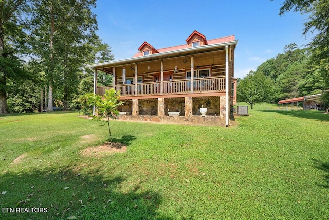 1821 S Nopone Valley Rd, Decatur, TN 37322 - rear view of house with a lawn, stone siding, and a metal roof