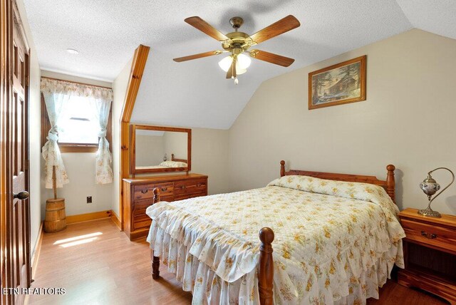 1821 S Nopone Valley Rd, Decatur, TN 37322 - bedroom with lofted ceiling, light wood finished floors, a textured ceiling, and ceiling fan