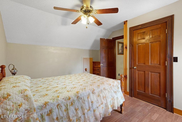 1821 S Nopone Valley Rd, Decatur, TN 37322 - bedroom with lofted ceiling, wood finished floors, a textured ceiling, and a ceiling fan