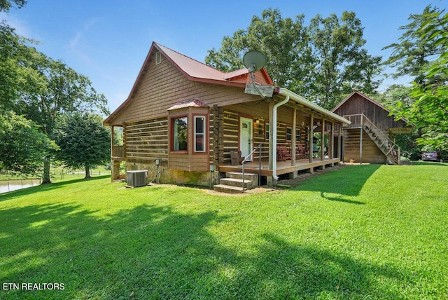 1821 S Nopone Valley Rd, Decatur, TN 37322 - view of home's exterior featuring a lawn, covered porch, log exterior, and stairs