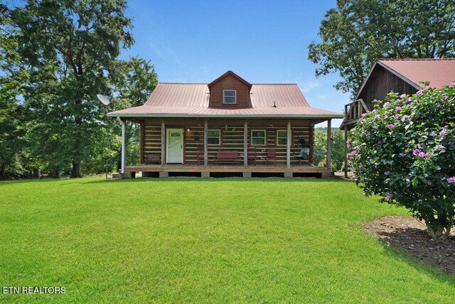 1821 S Nopone Valley Rd, Decatur, TN 37322 - back of property with a lawn, a porch, and a metal roof