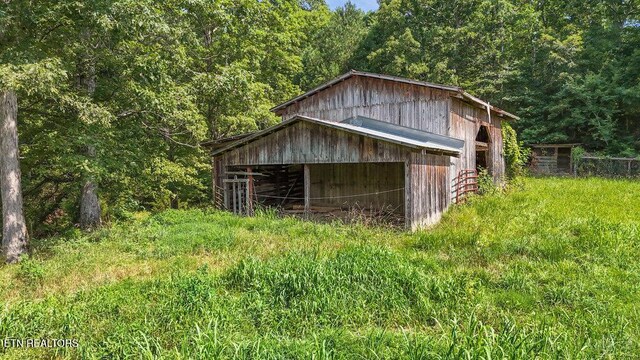 1821 S Nopone Valley Rd, Decatur, TN 37322 - view of pole building featuring a forest view