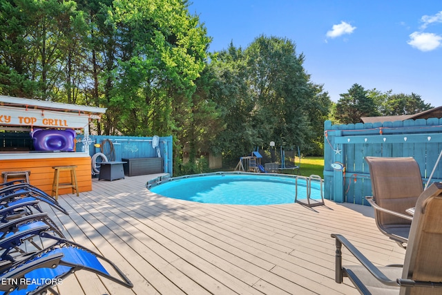 1717 Meadow Ridge Cir, Sevierville, TN 37862 - swimming pool featuring a deck and a trampoline