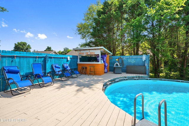 1717 Meadow Ridge Cir, Sevierville, TN 37862 - swimming pool featuring a wooden deck and a fenced backyard