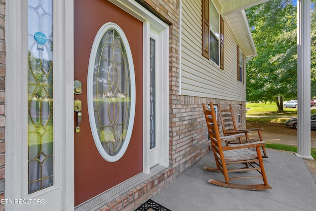 1717 Meadow Ridge Cir, Sevierville, TN 37862 - view of exterior entry with a porch and brick siding