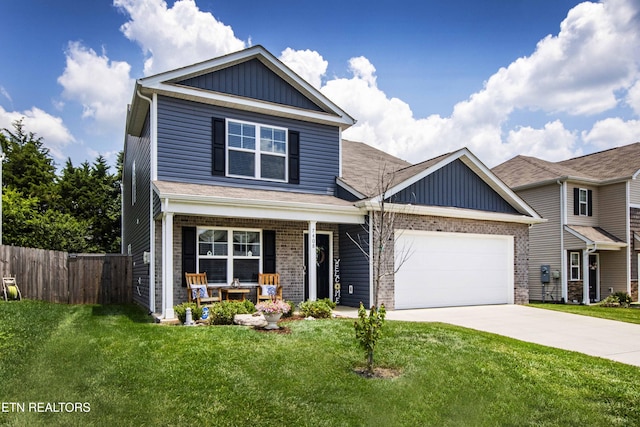 7408 Game Bird St, Corryton, TN 37721 - view of front of property featuring covered porch, a garage, board and batten siding, and driveway