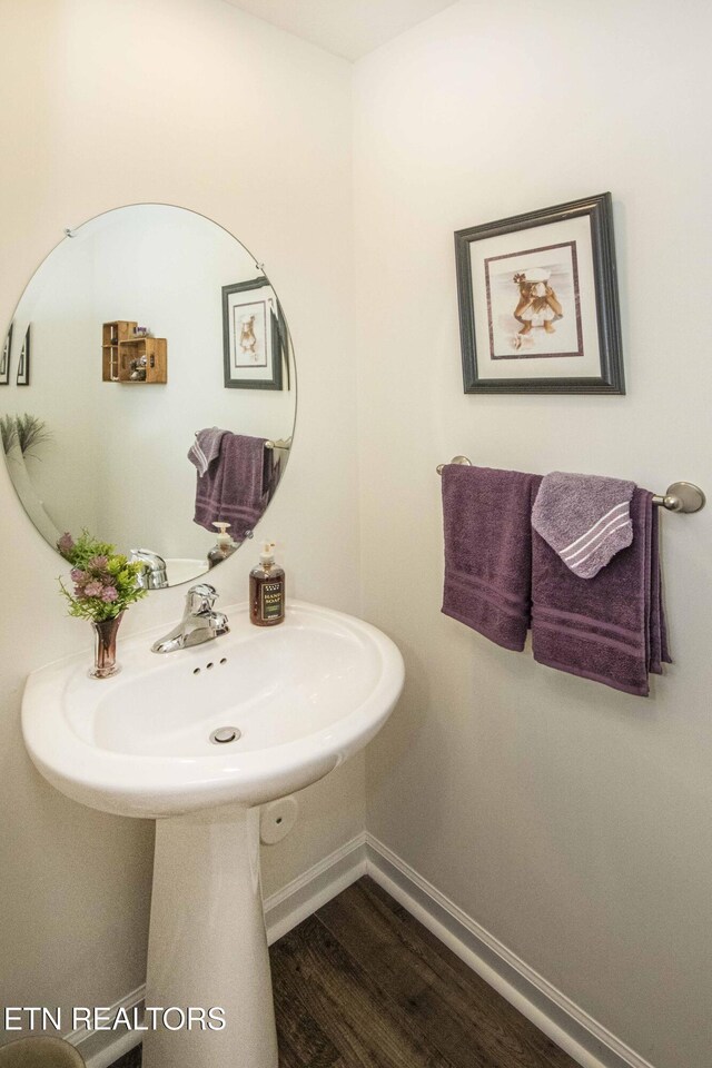 7408 Game Bird St, Corryton, TN 37721 - bathroom with baseboards and wood finished floors
