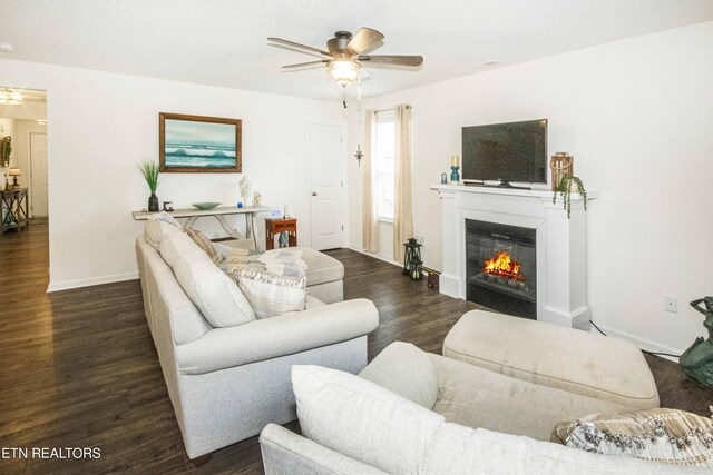 7408 Game Bird St, Corryton, TN 37721 - living area featuring ceiling fan, a glass covered fireplace, and dark wood-type flooring