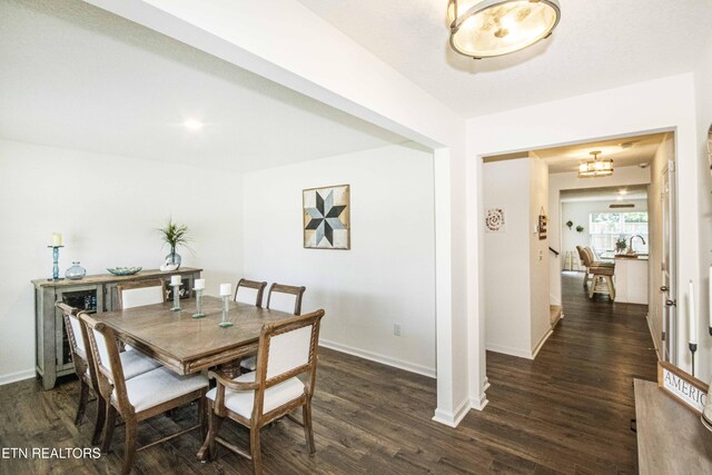 7408 Game Bird St, Corryton, TN 37721 - dining area with dark wood finished floors and a chandelier